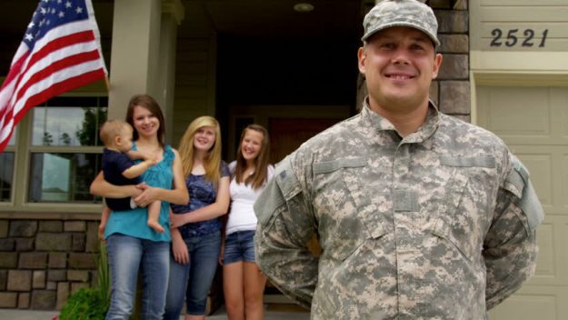 veteran-family-in-front-of-home